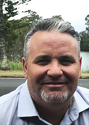 Portait of man wearing light blue shirt