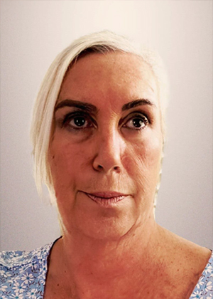 Portrait of blonde woman in light blue floral dress