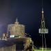A new high voltage substation kiosk is craned into position on Fort Denison at night