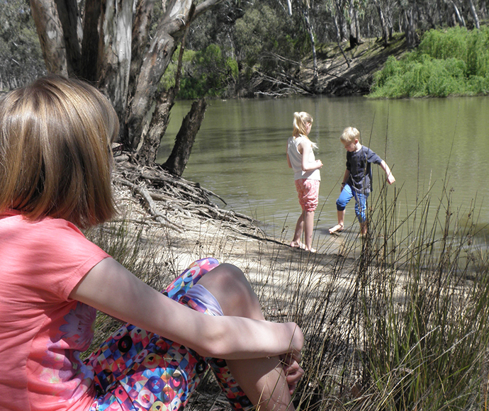 Children playing on the banks of the Edward River