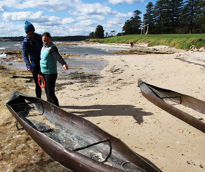 Nuwi Canoe Sculptures - Close-up: Close-up of "Nuwi" canoe sculptures near the water, crafted to represent traditional Aboriginal canoes, highlighting the maritime culture of local Indigenous communities.