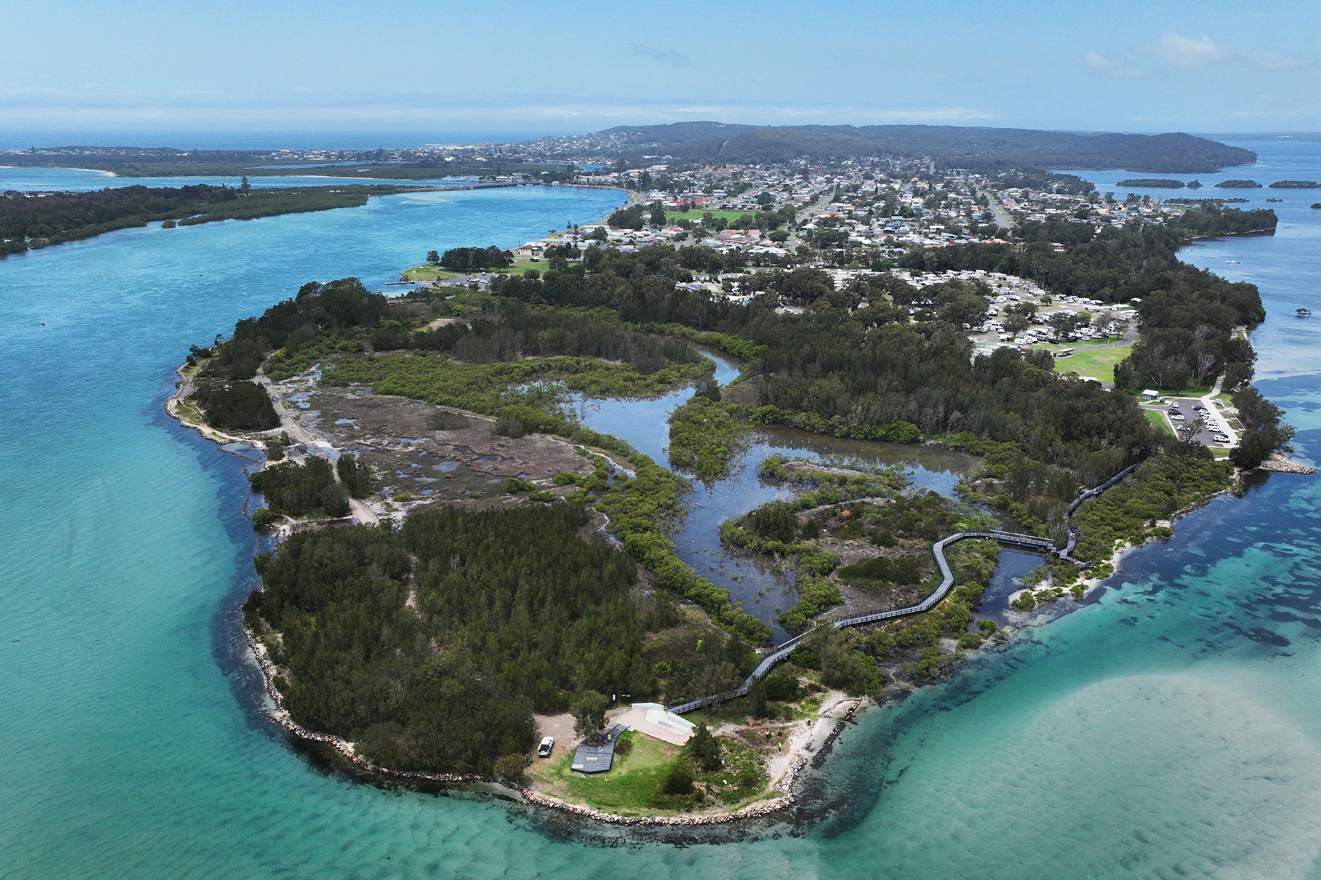 Island surrunded by teal-blue water